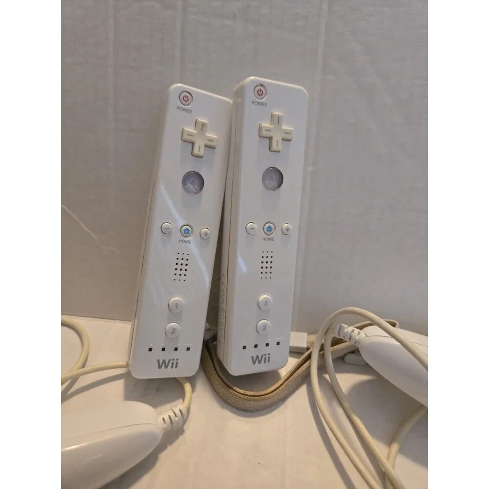 Pair Of Nintendo Wii Remotes With Nunchucks